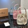 Bolso de mano Coach con tejido de cuero